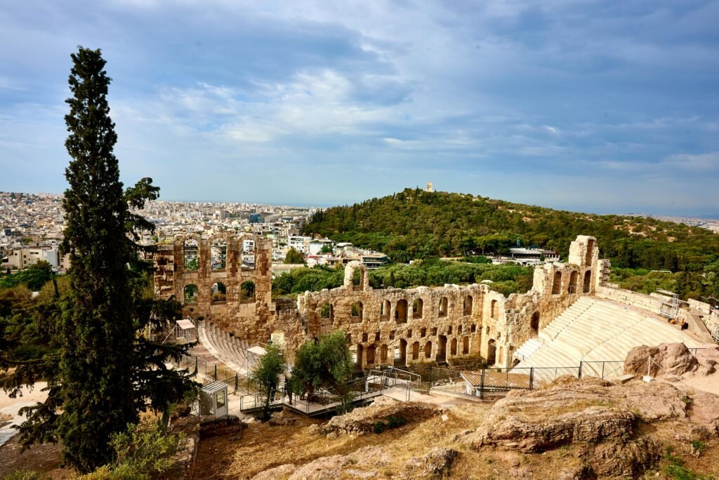 Ancient ruins overlooking a city.